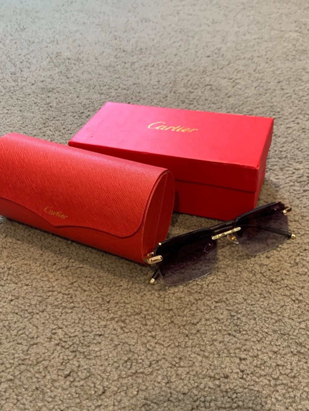 Cartier Women's Rimless Sunglasses with Gold Hardware and Smoke Lenses